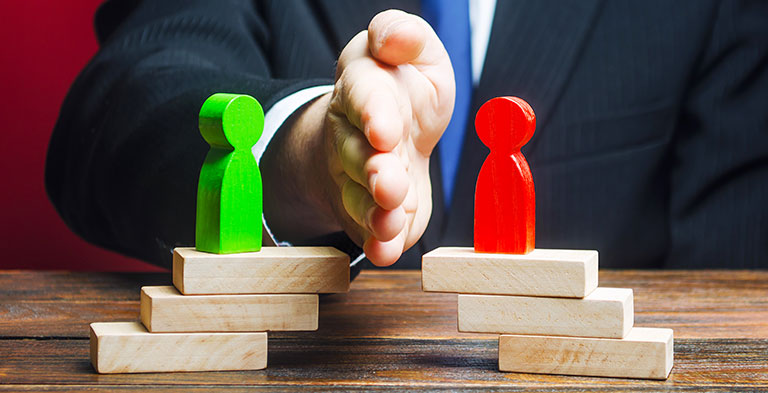 Man divides conflicting sides parties with a hand