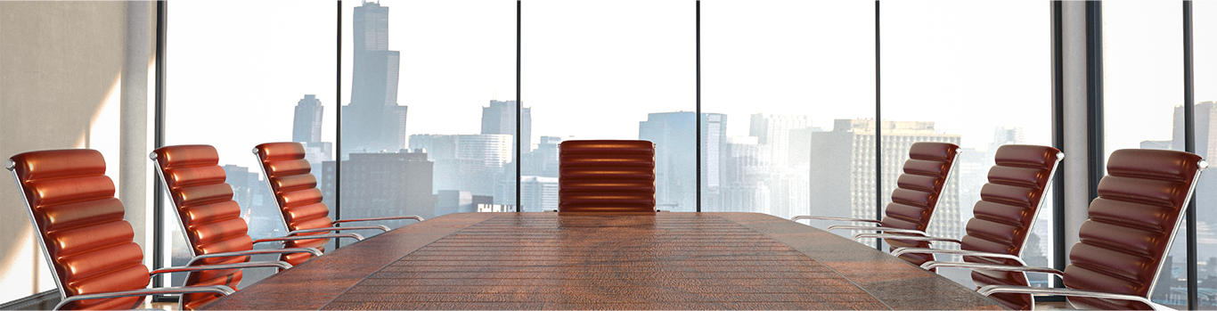 A clean boardroom with empty chairs