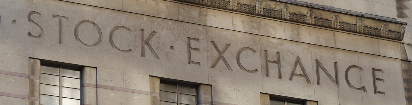 Old building with the words Stock Exchange engraved on the exterior wall