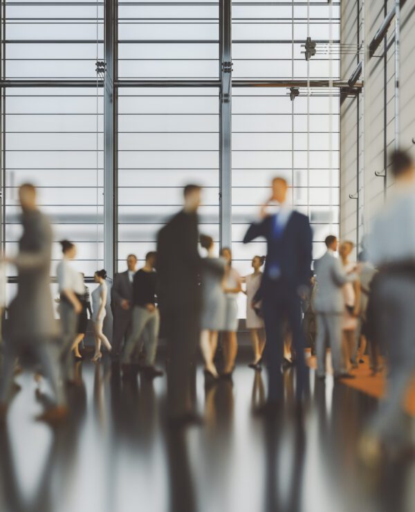 Large group of business people in convention centre, 3D generated image.