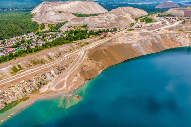 Eco-friendly building in the modern city. Sustainable glass office building with tree for reducing heat and carbon dioxide. Office building with green environment. Corporate building reduce CO2.